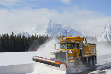 Snow Plow dump truck in Teton national park after blizzard
