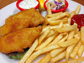 A Plate of Battered Fried Fish Fillets with French Fries