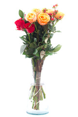 bouquet of colorful roses in a vase on white background