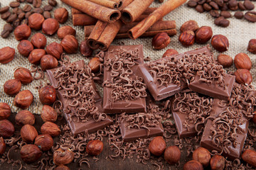 Chocolate, hazelnut, coffee and cinnamon sticks with cloth on a