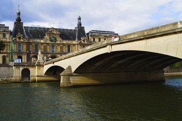 Obraz premium Arch bridge with a palace, Luxembourg Palace, Seine River, Paris