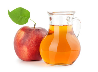 Jug of apple juice with ripe fruit