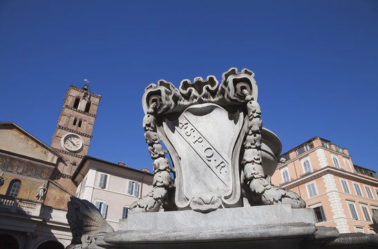 Fountain with Basilica di Santa Maria in background, Rome, Italy