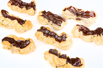 Fresh eclairs with coffee cream inside and chocolate