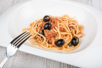 Spaghetti a la puttanesca with caper and olives