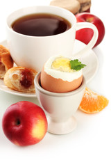 Light breakfast with boiled egg and cup of coffee, isolated