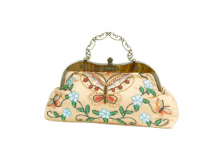 A luxury lady handbag decorated by colorful beads.