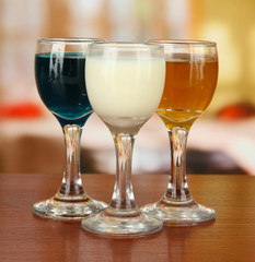 Tasty color liquors, on bright background