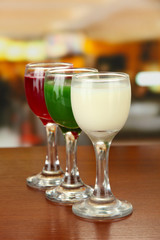 Tasty color liquors, on bright background