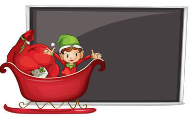 A boy riding in a sleigh with gifts