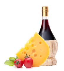 Red wine bottle, cheese and tomato still life