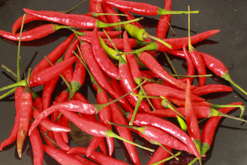 Red chili on the black plate