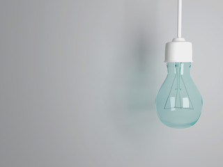 Glassy light bulb on gray background.