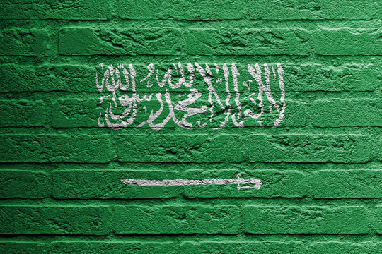Brick wall with a painting of a flag, Saudi Arabia