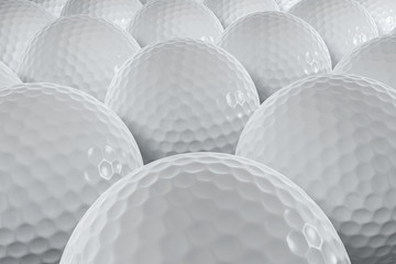 A closeup shot of many golfballs.