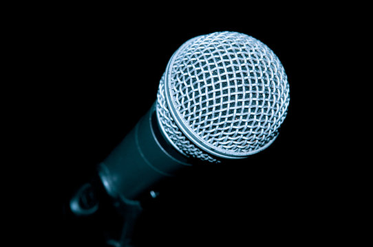 Microphone closeup on black background