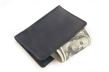 US dollars in a black wallet isolated on white