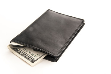 US dollars in a black wallet isolated on white