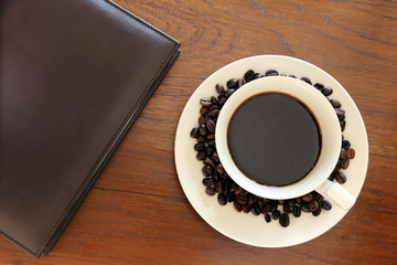 note book with coffee cup