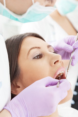 Obraz na płótnie Canvas Kobieta u dentysty