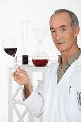 wine waiter showing glass of wine