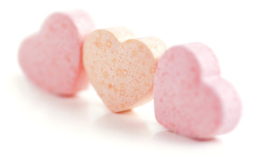 Sweet hearts shaped pink and orange Sugar Pills. Soft Focus.