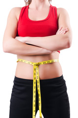 Young girl with centimeter in dieting concept