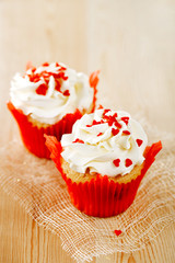 red festive muffins with heart candy and  wood