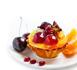 Sweet fruit cake isolated on white