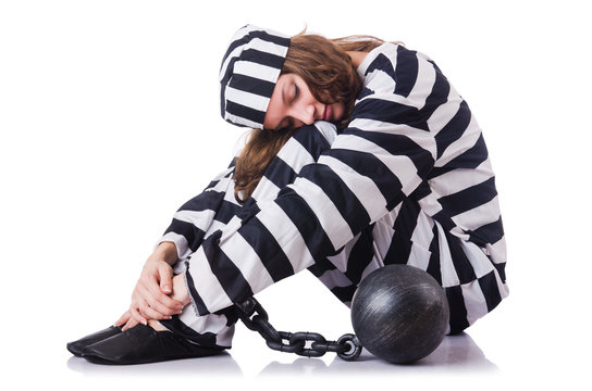 Prisoner in striped uniform on white