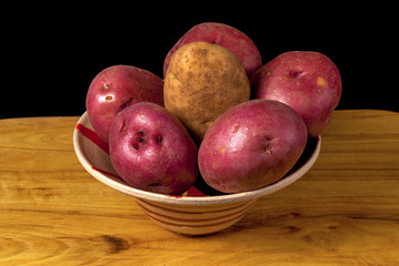 Fresh natural potatoes in a bowl