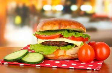 Big and tasty hamburger on table in cafe