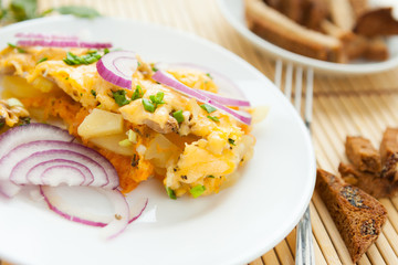 Vegetable pudding with cheese on a plate