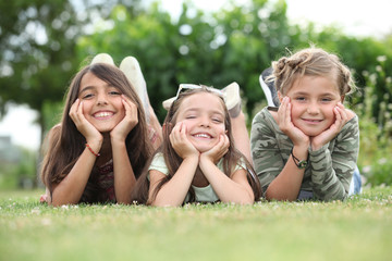 Fototapeta premium Girls lying on grass