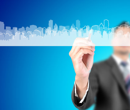 business man drawing city and building