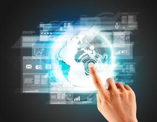 Fototapeta premium hand touching digital virtual technology in the world
