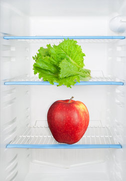 Lettuce and apple in the refrigerator