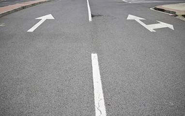 Arrows on asphalt
