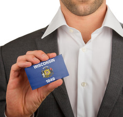 Businessman is holding a business card, Wisconsin