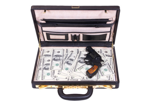case with money and a revolver