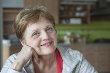 happy senior woman at home relaxing