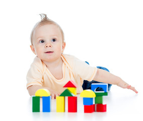 little child playing with building blocks