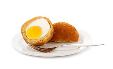 Egg ball (Eierbal) cut in half on saucer