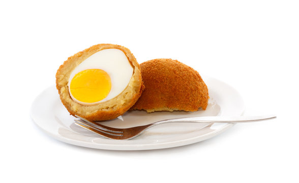 Egg ball (Eierbal) cut in half on saucer