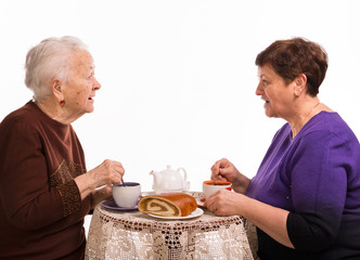 Mother having tea with her daughter