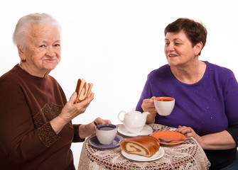 Mother having tea with her daughter