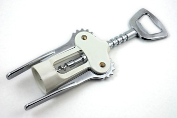 Corkscrew for wine and cork on a white background