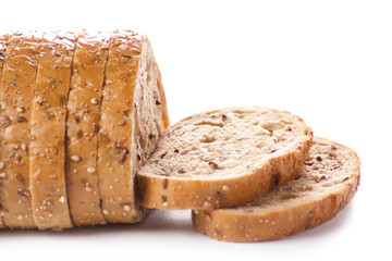 Healthy whole grain sliced bread with sunflower seeds on white b