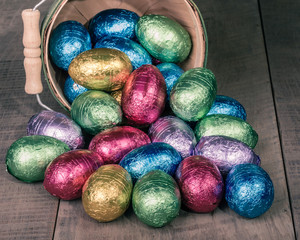 Wicker basket of colorful foil eggs