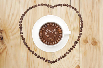 coffee cup on wooden plank background
